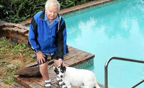 Lucky save: Tom Harrison had to save his flailing dog Aussie from the family pool. Lucky save: Tom Harrison had to save his flailing dog Aussie from the family pool.