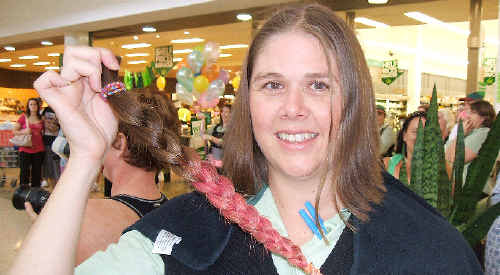 Donna Shaw with the hair she cut off to help out Rylee Rivett. Donna Shaw with the hair she cut off to help out Rylee Rivett.