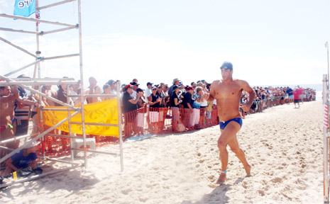 Olympian Ky Hurst crosses the finishing line to win last Sunday’s swim classic. Olympian Ky Hurst crosses the finishing line to win last Sunday’s swim classic.