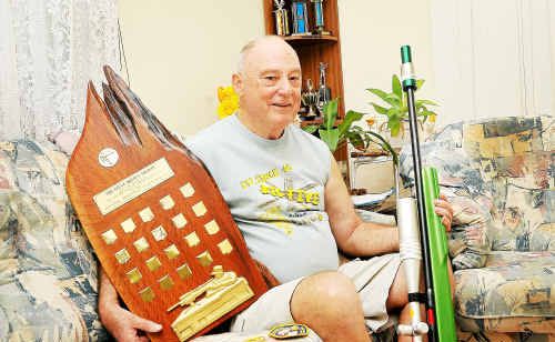 John Radford with his impressive title trophy. John Radford with his impressive title trophy.