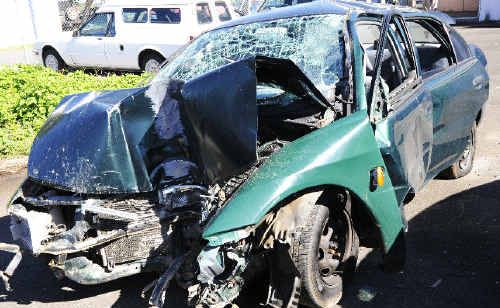 Passenger responsibility: Five teenagers, including the L-plate driver, were seriously injured when this Mitsubishi Magna hit a telegraph pole (pictured below) in Ocean Drive, Evans Head, at high speed on Saturday night. Passenger responsibility: Five teenagers, including the L-plate driver, were seriously injured when this Mitsubishi Magna hit a telegraph pole (pictured below) in Ocean Drive, Evans Head, at high speed on Saturday night.