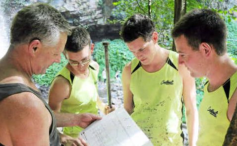 EXPERTS: The New Zealand bridge builders inspect the plans. EXPERTS: The New Zealand bridge builders inspect the plans.