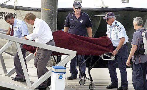 The body of a Korean tourist who died in Fraser Island’s Lake Wabby (below) is brought back to the mainland at Hervey Bay marina on Saturday. The body of a Korean tourist who died in Fraser Island’s Lake Wabby (below) is brought back to the mainland at Hervey Bay marina on Saturday.