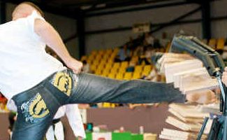 Gold medal for Martial Arts Master Phil Monaghan ups the ante on seven board break. Gold medal for Martial Arts Master Phil Monaghan ups the ante on seven board break.