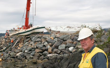 Some of the last tangible reminders of Cyclone Ului were removed yesterday with the wrecks of Anaconda II and Aquaholic salvaged from the rocks adjacent to the Whitsunday Sailing Club. Part owner of Aquaholic, Bob Dalby, was on the scene to farewell his yacht. Some of the last tangible reminders of Cyclone Ului were removed yesterday with the wrecks of Anaconda II and Aquaholic salvaged from the rocks adjacent to the Whitsunday Sailing Club. Part owner of Aquaholic, Bob Dalby, was on the scene to farewell his yacht.