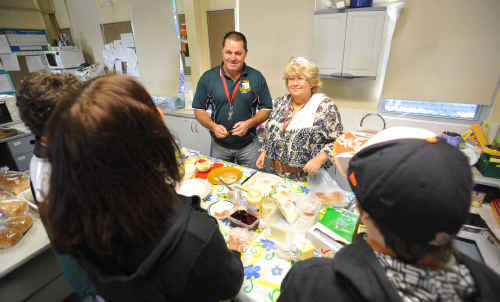 Maclean High School teachers Steve Woods and Sharon Tarrant help serve some students at the school’s breakfast club. Maclean High School teachers Steve Woods and Sharon Tarrant help serve some students at the school’s breakfast club.