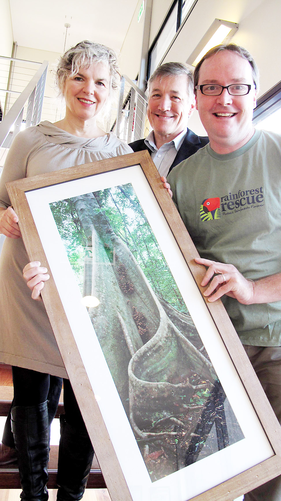 CEO of Rainforest Rescue, Kelvin Davies, with Pam and Martin Brook, co-founders of Brookfarm, inside Brookfarm’s warehouse in the Byron Industrial Estate. CEO of Rainforest Rescue, Kelvin Davies, with Pam and Martin Brook, co-founders of Brookfarm, inside Brookfarm’s warehouse in the Byron Industrial Estate.