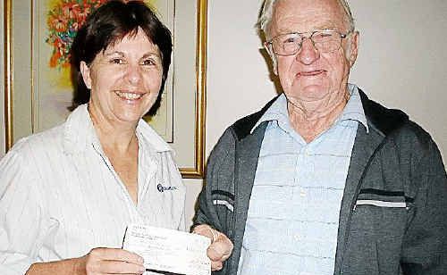 Blue Care Warwick service manager Sue Hoopmann receives a donation from Warwick and District Lapidary Club president Sid Woodrow. Blue Care Warwick service manager Sue Hoopmann receives a donation from Warwick and District Lapidary Club president Sid Woodrow.