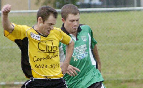 Goonellabah’s Dave Annetts (left) works hard to keep possession from a Maclean opponent in their Solo Cup knockout match at Weston Park, Goonellabah, on Saturday. Goonellabah’s Dave Annetts (left) works hard to keep possession from a Maclean opponent in their Solo Cup knockout match at Weston Park, Goonellabah, on Saturday.