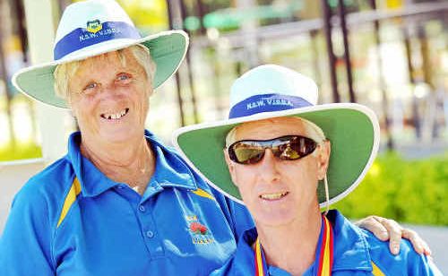 Vision impaired bowler Wayne Thomson with his wife and director Lynne after they teamed up to win a gold and bronze medal at the recent Australian Championships. Vision impaired bowler Wayne Thomson with his wife and director Lynne after they teamed up to win a gold and bronze medal at the recent Australian Championships.