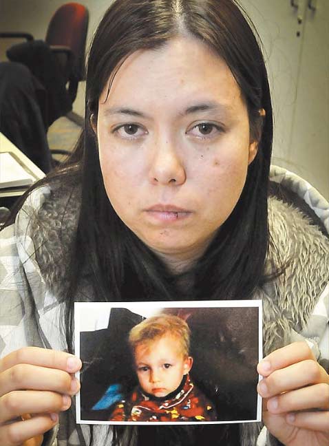 Darrlena Mogg, 26, holds a photo of her two-year-old son who has been missing for almost a week. Darrlena Mogg, 26, holds a photo of her two-year-old son who has been missing for almost a week.