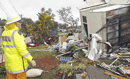 Devastating: NSW Rural Fire Service personnel inspect the Lake Ainsworth Caravan Park after a tornado hit Lennox Head yesterday. Devastating: NSW Rural Fire Service personnel inspect the Lake Ainsworth Caravan Park after a tornado hit Lennox Head yesterday.