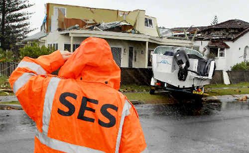 DRY DOCK: A boat and trailer were lifted onto the footpath on Pacific Parade at the height of the tornado that hit Lennox Head early yesterday morning. DRY DOCK: A boat and trailer were lifted onto the footpath on Pacific Parade at the height of the tornado that hit Lennox Head early yesterday morning.