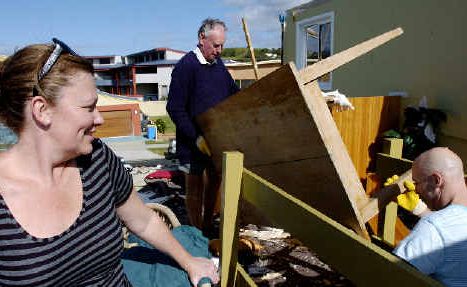 Lennox rebounds: Dodie Bischoff watches as her husband Tony (right) and long-time Lennox Head resident and neighbour John Stewart collect debris from their tornado-ravaged home in Pacific Parade on Saturday. Lennox rebounds: Dodie Bischoff watches as her husband Tony (right) and long-time Lennox Head resident and neighbour John Stewart collect debris from their tornado-ravaged home in Pacific Parade on Saturday.