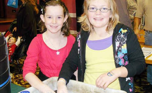 Eight-year-old Kate Potter and nine-year-old Brooke Williams get their hands dirty with a worm farm. Eight-year-old Kate Potter and nine-year-old Brooke Williams get their hands dirty with a worm farm.