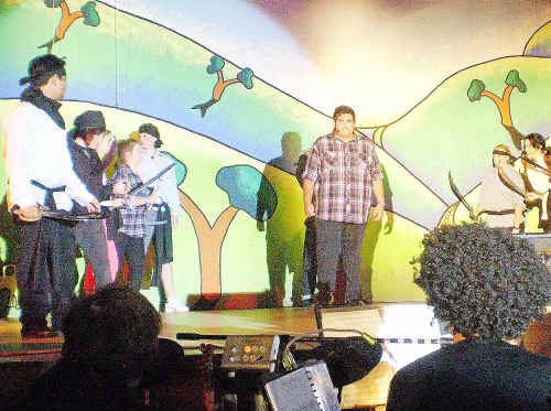 SING-A-LONG: Leading man Patrick Brown (centre) did Woolgoolga High School proud in their production of Simple Simon. SING-A-LONG: Leading man Patrick Brown (centre) did Woolgoolga High School proud in their production of Simple Simon.