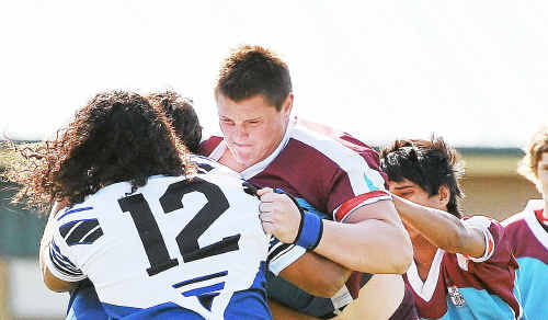 Hard-working JPC front rower Dan Killian is confronted by Kristian Kelly (12) in yesterday’s ARL Schoolboy Trophy victory. Hard-working JPC front rower Dan Killian is confronted by Kristian Kelly (12) in yesterday’s ARL Schoolboy Trophy victory.