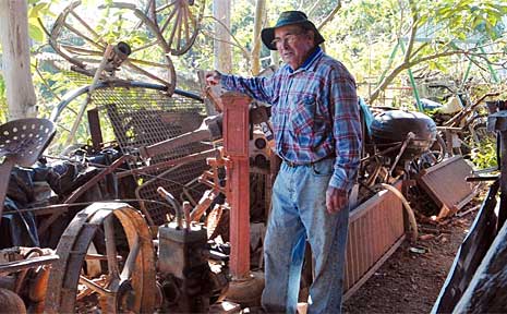 Doug Hoschke in one of his crowded farm sheds. Doug Hoschke in one of his crowded farm sheds.