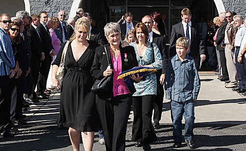Family and friends leaving the chapel after the service. Family and friends leaving the chapel after the service.