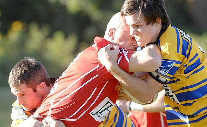 Byron Red Devils Duane Cahill runs into the Mullumbimby defence at a previous game. Byron Red Devils Duane Cahill runs into the Mullumbimby defence at a previous game.