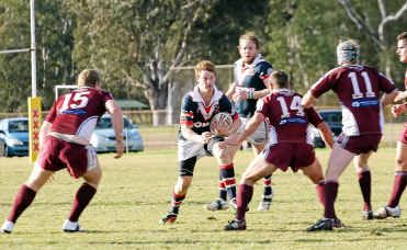 Warwick Cowboys player Jarred Bradfield on the attack against the Dalby Diehards. Warwick Cowboys player Jarred Bradfield on the attack against the Dalby Diehards.