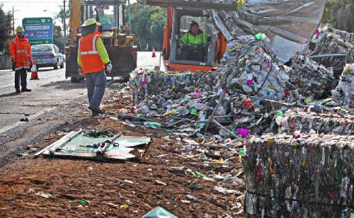 The scene Ulmarra residents woke to after a truck rolled on a Pacific Highway bend at the southern end of the village. The scattered debris was the truck’s cargo of recycled plastic. The scene Ulmarra residents woke to after a truck rolled on a Pacific Highway bend at the southern end of the village. The scattered debris was the truck’s cargo of recycled plastic.