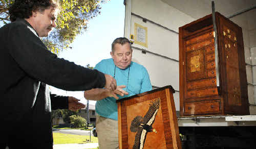 Lismore master craftsman Geoff Hannah (right) and student Gary Shallala-Hudsonload the dismantled Hannah Cabinet on to a truck before transporting it to Sydney. Lismore master craftsman Geoff Hannah (right) and student Gary Shallala-Hudsonload the dismantled Hannah Cabinet on to a truck before transporting it to Sydney.
