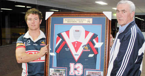 Warwick Cowboys 2010 club captain Ryan McIvor and inaugural 1986 A-grade captain Brian Dunne with one of 17 framed jerseys to be auctioned at 25th anniversary celebrations. Warwick Cowboys 2010 club captain Ryan McIvor and inaugural 1986 A-grade captain Brian Dunne with one of 17 framed jerseys to be auctioned at 25th anniversary celebrations.