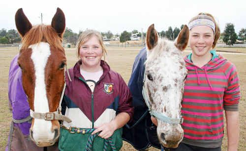 Stanthorpe sisters Ellie, (holding Billy) and Kasey (holding Ace) Charlton are competing in this week’s Queensland Inter-school Equestrian Championships at the Warwick Showgrounds. Stanthorpe sisters Ellie, (holding Billy) and Kasey (holding Ace) Charlton are competing in this week’s Queensland Inter-school Equestrian Championships at the Warwick Showgrounds.