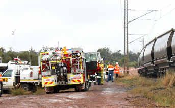 Emergency services crews at the site of the fatal collision between a four-wheel drive and a coal train. Emergency services crews at the site of the fatal collision between a four-wheel drive and a coal train.