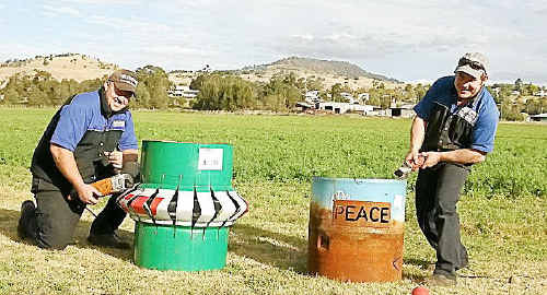 James Richards and Paul Fox work on their drums ready for the fire drum competition at the Killarney Aged Care Winter In Killarney Bonfire Night this Saturday. James Richards and Paul Fox work on their drums ready for the fire drum competition at the Killarney Aged Care Winter In Killarney Bonfire Night this Saturday.