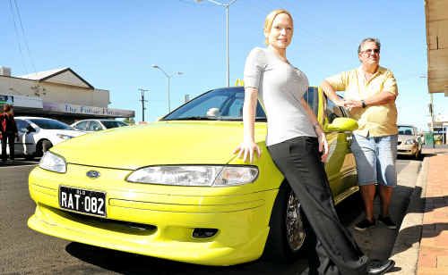 Cure 4 Cancer Car Rally organiser Brett Taylor with Rachel Mitchell and her Ford Falcon EF V8. Cure 4 Cancer Car Rally organiser Brett Taylor with Rachel Mitchell and her Ford Falcon EF V8.