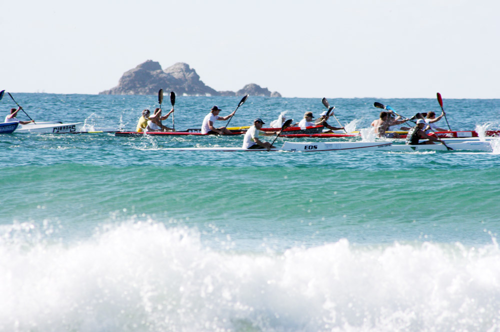 Competitors in Saturday’s race put in the big strokes at Main Beach on the way to the cape. Competitors in Saturday’s race put in the big strokes at Main Beach on the way to the cape.