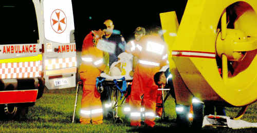 Emergency: Robert Grady, of Glen Innes, is loaded aboard the Westpac Lifesaver Rescue Helicopter on Wednesday night after falling 10 metres down a cliff at Pilot Hill at Yamba. Emergency: Robert Grady, of Glen Innes, is loaded aboard the Westpac Lifesaver Rescue Helicopter on Wednesday night after falling 10 metres down a cliff at Pilot Hill at Yamba.