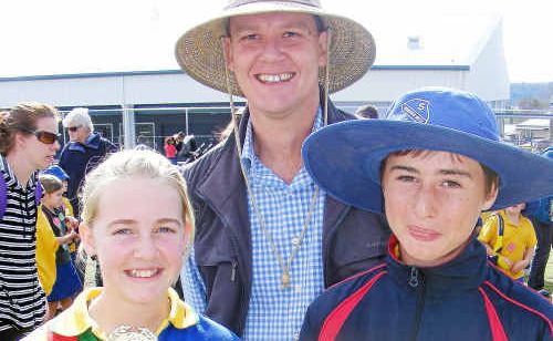 Sturt House athletics winning Years P-3 captains Olivia Noble and Bradley Morrish with Warwick West State School principal Jason Callcott. Sturt House athletics winning Years P-3 captains Olivia Noble and Bradley Morrish with Warwick West State School principal Jason Callcott.