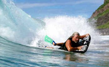 WELCOME BACK MAT: Lennox Head surfer Mark Thomson rides a surf mat off Lennox Point. WELCOME BACK MAT: Lennox Head surfer Mark Thomson rides a surf mat off Lennox Point.