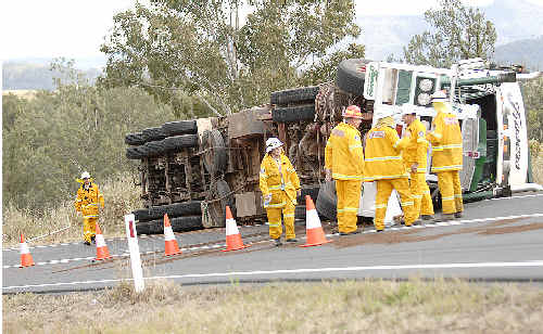 Kyogle rescuers survey the scene where a cattle truck carrying 70 head of cattle tipped while negotiating a bend near Old Grevillea. Kyogle rescuers survey the scene where a cattle truck carrying 70 head of cattle tipped while negotiating a bend near Old Grevillea.