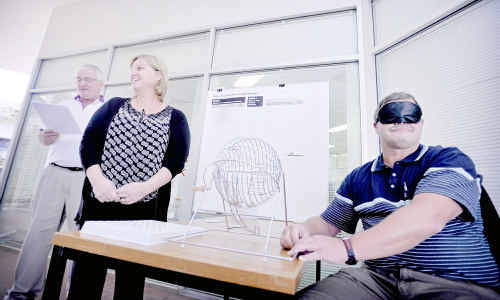 Political bondage: Page Divisional Returning Officer Leigh Thurgood, left, and clerks Cindy Mitchell and (looking a little like a caped crusader) Malcolm Eggins do the official draw for the Australian Electoral Commission in Grafton. Political bondage: Page Divisional Returning Officer Leigh Thurgood, left, and clerks Cindy Mitchell and (looking a little like a caped crusader) Malcolm Eggins do the official draw for the Australian Electoral Commission in Grafton.