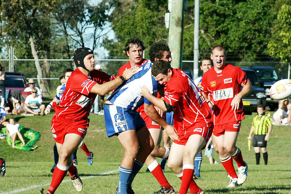 The Red Devils muscle up in defence against Ghosts at Byron Bay on Sunday.
The Red Devils muscle up in defence against Ghosts at Byron Bay on Sunday.