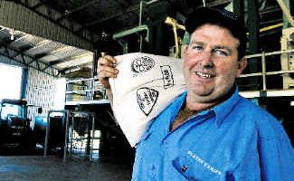 In the bag: Rain-fed biodynamic rice farmer Brett Slater pictured in front of the mill he has installed at his Fairy Hill property. In the bag: Rain-fed biodynamic rice farmer Brett Slater pictured in front of the mill he has installed at his Fairy Hill property.