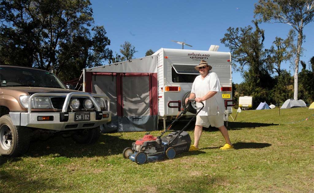 Shane 'Buttsy' Butler from Woongoolba, south of Brisbane, works up a thirst at the Muster mowing his neighbours' campsite. Shane 'Buttsy' Butler from Woongoolba, south of Brisbane, works up a thirst at the Muster mowing his neighbours' campsite.
