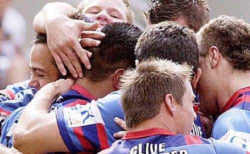 Members of the Clydesdales 2006 squad celebrate a try during a match. Members of the Clydesdales 2006 squad celebrate a try during a match.