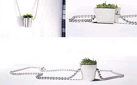 The Growing Jewelry House collection by HAF features a silver ball chain necklace with a potted plant at the end with real growing moss inside. The Growing Jewelry House collection by HAF features a silver ball chain necklace with a potted plant at the end with real growing moss inside.