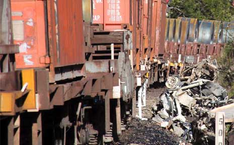 The remains of a 4WD after it collided with a freight train at Coramba. The remains of a 4WD after it collided with a freight train at Coramba.