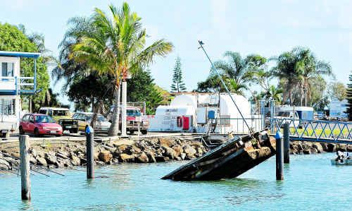 A pontoon at Burnett Heads Marina slowly sinks after its breathing pipe broke. A pontoon at Burnett Heads Marina slowly sinks after its breathing pipe broke.