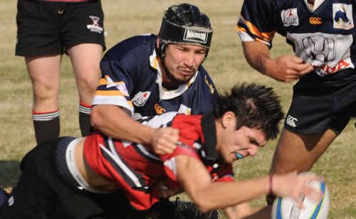Alloway’s Nathan Freeman tries to stop Barbarian Andrew Farrer from scoring a try in last year’s grand final. Alloway’s Nathan Freeman tries to stop Barbarian Andrew Farrer from scoring a try in last year’s grand final.