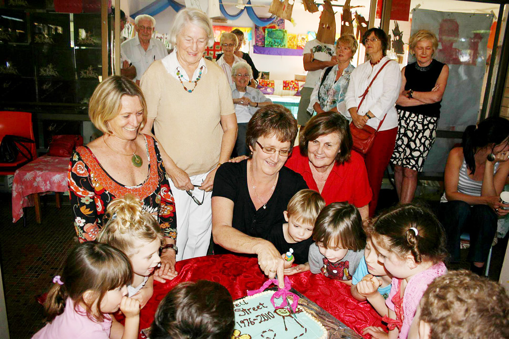 Cutting the cake to farewell the Byron Bay Preschool’s Jonson Street Centre is preschool assistant Lee Elliott. She is watched by preschool director Victoria Handley (left), Ann Tiernan, who was the pre-school’s first director in 1975, former co-director Ann McCabe and a group of preschoolers. Cutting the cake to farewell the Byron Bay Preschool’s Jonson Street Centre is preschool assistant Lee Elliott. She is watched by preschool director Victoria Handley (left), Ann Tiernan, who was the pre-school’s first director in 1975, former co-director Ann McCabe and a group of preschoolers.