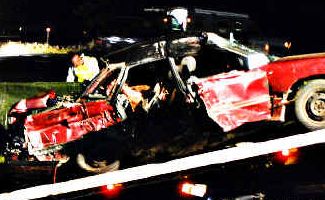 The Subaru Liberty sedan, in which three young men died after being hit by a B-double on the Pacific Highway 2km north of the Byron Bay interchange, is removed from the scene. The Subaru Liberty sedan, in which three young men died after being hit by a B-double on the Pacific Highway 2km north of the Byron Bay interchange, is removed from the scene.