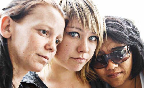 Rebecca Tannock (left), Cherry Stunners and Jo Gordon, of Ocean Shores, grieve for their friends who were killed in the collision at Ewingsdale on Thursday night. Rebecca Tannock (left), Cherry Stunners and Jo Gordon, of Ocean Shores, grieve for their friends who were killed in the collision at Ewingsdale on Thursday night.