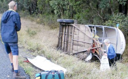 Smashed up: The driver of a utility retrieves items from her horse float at the Tiki Rd accident at Moonee. Smashed up: The driver of a utility retrieves items from her horse float at the Tiki Rd accident at Moonee.